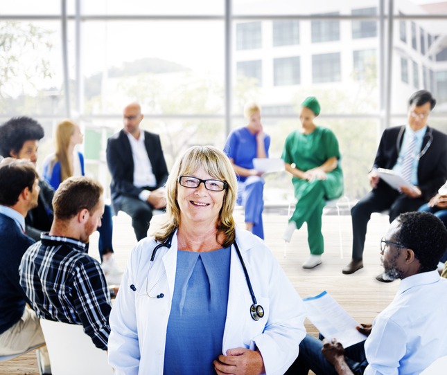 Female Doctor Standing in Front of a Support Group